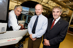 photograph - Three men and flight simulator