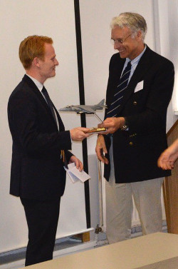 photograph - Sam Poole being presented with the Harrier Trophy by test pilot Dave Southwood