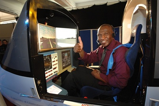 Man sitting in Flight Simulator - photograph